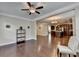 Spacious living area featuring hardwood floors and an open view into the kitchen and neutral decor at 4395 Wildbrooke Pkwy, Cumming, GA 30041