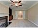 Comfortable living room with fireplace and built-in bookshelves at 4395 Wildbrooke Pkwy, Cumming, GA 30041