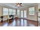 Inviting living space featuring hardwood floors and plenty of natural light and neutral decor at 4395 Wildbrooke Pkwy, Cumming, GA 30041