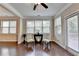 Well-lit living area with hardwood floors and windows, offering a comfortable and inviting atmosphere at 4395 Wildbrooke Pkwy, Cumming, GA 30041