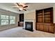 Comfortable living room with fireplace and built-in bookshelves at 4395 Wildbrooke Pkwy, Cumming, GA 30041