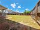 Large, fenced backyard with lush lawn and patio at 1264 Brynhill Ct, Buford, GA 30518
