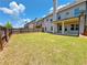 Large, fenced backyard featuring a well-maintained lawn and patio at 1264 Brynhill Ct, Buford, GA 30518