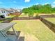 Large backyard with a well-maintained lawn and a tall wooden fence at 1264 Brynhill Ct, Buford, GA 30518