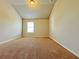 Neutral bedroom featuring carpet, a window letting in light, and neutral walls at 1264 Brynhill Ct, Buford, GA 30518