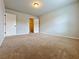 Bedroom with plush carpeting, neutral walls, and natural light from window at 1264 Brynhill Ct, Buford, GA 30518