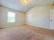Bright bedroom with plush carpeting and a large window offering natural light at 1264 Brynhill Ct, Buford, GA 30518