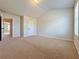 A spacious carpeted bedroom features neutral walls and an open doorway at 1264 Brynhill Ct, Buford, GA 30518