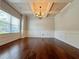 Elegant dining room with hardwood floors, coffered ceiling, and wainscoting at 1264 Brynhill Ct, Buford, GA 30518
