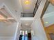 Bright, open foyer with soaring ceilings and decorative staircase railing detail at 1264 Brynhill Ct, Buford, GA 30518