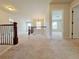 Hallway with wrought iron railing and carpet, leading into other rooms at 1264 Brynhill Ct, Buford, GA 30518