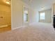 Hallway featuring plush carpet and access to laundry and bedroom at 1264 Brynhill Ct, Buford, GA 30518