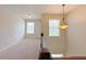 Spacious upstairs hallway with warm neutral walls and a decorative chandelier at 1264 Brynhill Ct, Buford, GA 30518