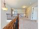Bright upstairs hallway with carpet, neutral walls, and decorative railing at 1264 Brynhill Ct, Buford, GA 30518