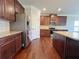 Well-equipped kitchen with stainless steel appliances, granite counters, and dark wood cabinetry at 1264 Brynhill Ct, Buford, GA 30518
