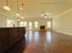 Bright open-concept living room featuring hardwood floors, a fireplace, and ample natural light at 1264 Brynhill Ct, Buford, GA 30518