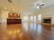 Open living space featuring hardwood floors, kitchen island, and a fireplace at 1264 Brynhill Ct, Buford, GA 30518