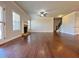 Spacious living room with hardwood floors, fireplace, and stairs to the second floor at 1264 Brynhill Ct, Buford, GA 30518