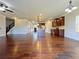 Open-concept living room and kitchen area with hardwood floors and natural light at 1264 Brynhill Ct, Buford, GA 30518