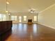 Expansive living room featuring hardwood floors, fireplace, and abundant natural light at 1264 Brynhill Ct, Buford, GA 30518