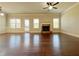 A spacious living room featuring hardwood floors, a fireplace, and plenty of natural light at 1264 Brynhill Ct, Buford, GA 30518