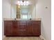 Double vanity with granite counters and dark wood cabinetry, providing ample storage in the bathroom at 1264 Brynhill Ct, Buford, GA 30518