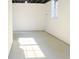Spacious unfinished basement with natural light from window, ready to be customized at 4011 Lake Carlton Rd, Loganville, GA 30052