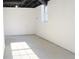 Spacious unfinished basement with natural light from window, ready to be customized at 4011 Lake Carlton Rd, Loganville, GA 30052