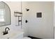 Bright bathroom with new white subway tile, black fixtures, and vanity at 4011 Lake Carlton Rd, Loganville, GA 30052