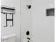 Upgraded bathroom with shower, black fixtures and towel rack for added convenience at 4011 Lake Carlton Rd, Loganville, GA 30052