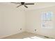 Bedroom featuring light wood laminate flooring and a window providing natural light at 4011 Lake Carlton Rd, Loganville, GA 30052
