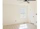 Bedroom featuring light wood laminate flooring and a window providing natural light at 4011 Lake Carlton Rd, Loganville, GA 30052