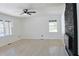 Bright living room featuring sleek floors, fireplace, and neutral walls at 4011 Lake Carlton Rd, Loganville, GA 30052