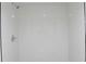 Modern shower with sleek white tile, chrome fixtures, and a clean design at 4011 Lake Carlton Rd, Loganville, GA 30052