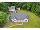 An aerial view of the house showcasing the yard, driveway and overall layout of the property at 4030 Grady Smith Road Rd, Loganville, GA 30052