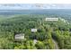 Wooded Loganville property showcasing proximity to Windsor along Grady Smith Rd. Detached garage shown inset at 4030 Grady Smith Road Rd, Loganville, GA 30052