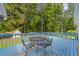 This home features a nice back deck with chairs and a table at 4030 Grady Smith Road Rd, Loganville, GA 30052