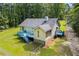 Backyard view featuring a spacious deck, fenced yard, and verdant landscaping, ideal for outdoor enjoyment at 4030 Grady Smith Road Rd, Loganville, GA 30052