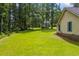 Beautiful, spacious backyard with mature trees and a gentle slope at 4030 Grady Smith Road Rd, Loganville, GA 30052