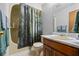 Bathroom featuring a vanity with a sink, shower with curtain, toilet, and bath tub at 4030 Grady Smith Road Rd, Loganville, GA 30052