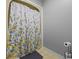 Bathroom featuring a shower with a floral curtain, toilet, and neutral tile at 4030 Grady Smith Road Rd, Loganville, GA 30052