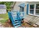 Side view of house with a blue painted deck and stairs at 4030 Grady Smith Road Rd, Loganville, GA 30052