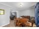 A dining room featuring a wood table and seating, with access to the living room at 4030 Grady Smith Road Rd, Loganville, GA 30052