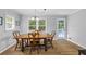 Inviting dining room with hardwood floors, natural light, and a wooden table with chairs at 4030 Grady Smith Road Rd, Loganville, GA 30052