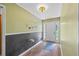 Inviting foyer featuring wood-look floors, a chalkboard accent wall, and decoratively displayed art at 4030 Grady Smith Road Rd, Loganville, GA 30052