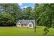 Picturesque single-Gathering home nestled among mature trees, boasting a well-kept lawn and welcoming facade at 4030 Grady Smith Road Rd, Loganville, GA 30052