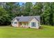 Traditional single-Gathering home with a spacious front yard, showcasing a classic design and serene setting at 4030 Grady Smith Road Rd, Loganville, GA 30052