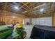 Spacious garage with a lawn mower and lots of storage at 4030 Grady Smith Road Rd, Loganville, GA 30052