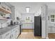 Clean kitchen featuring white cabinets, granite countertops, and open shelving at 4030 Grady Smith Road Rd, Loganville, GA 30052