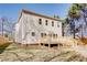 Exterior view of a newly built home with a wooden back deck and a spacious backyard at 3286 Bachelor Street, East Point, GA 30344